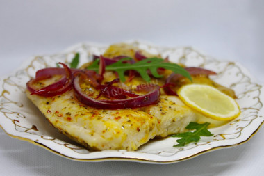 Pangasius na patelni z grillowanym cebulą